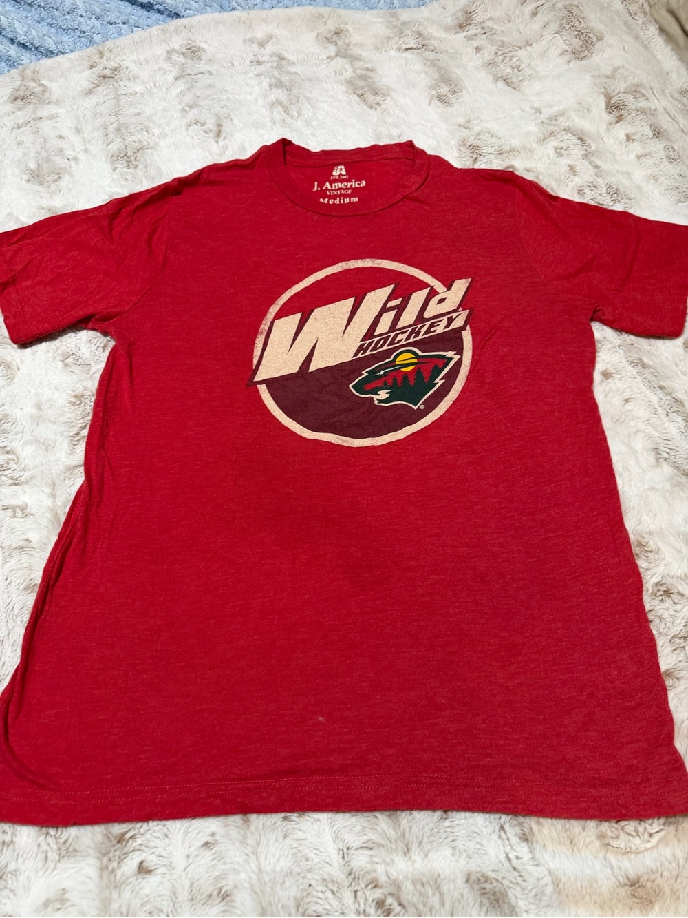 J. America Men’s Red Wild Hockey Logo Short Sleeve Tee